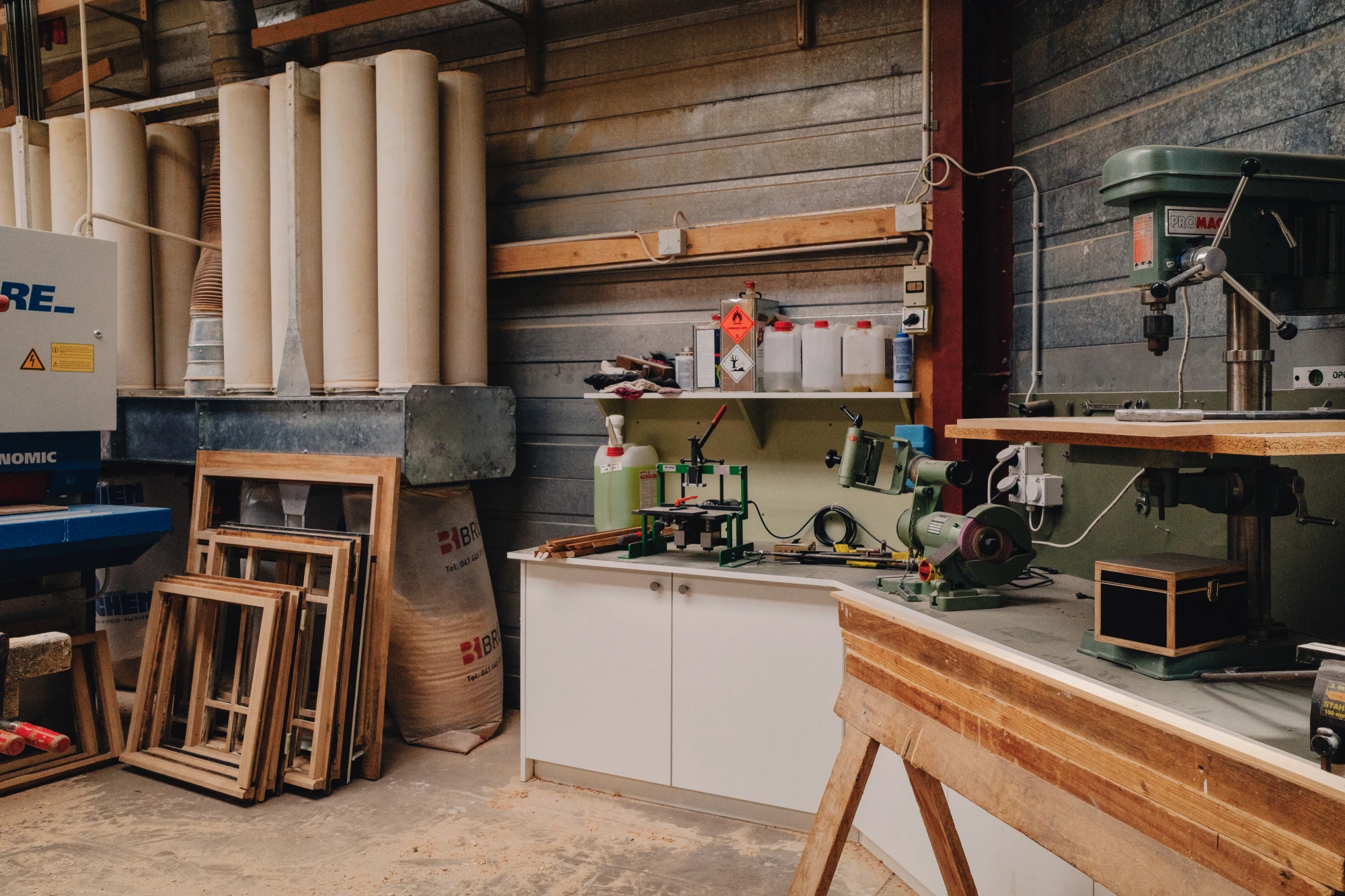 A workshop with two desks and power tools