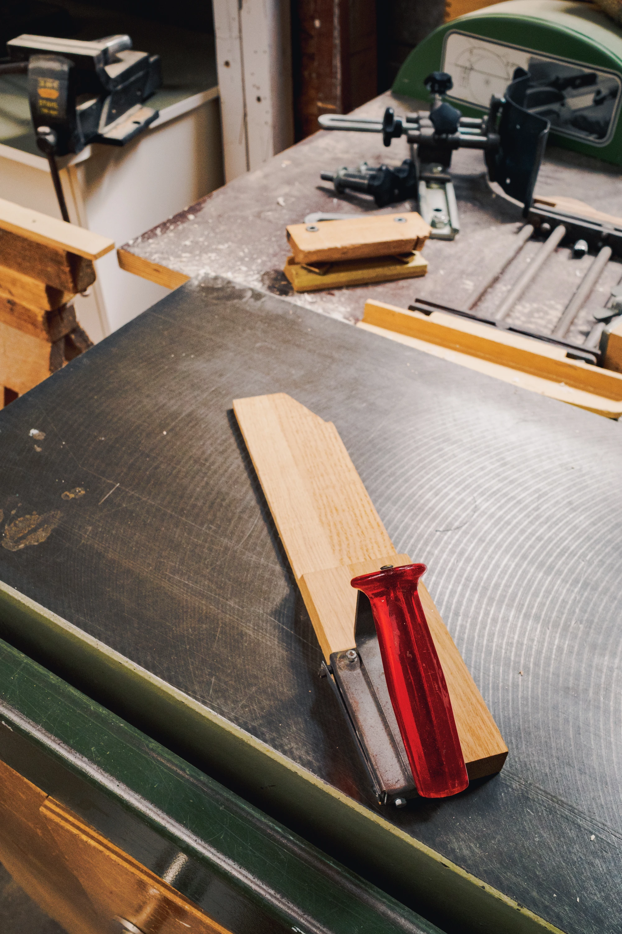 Piece of wood on a desk with a filer on top